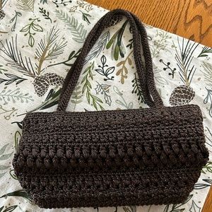 The Sak crocheted purse with top zipper and handles. Inside pockets for cards.